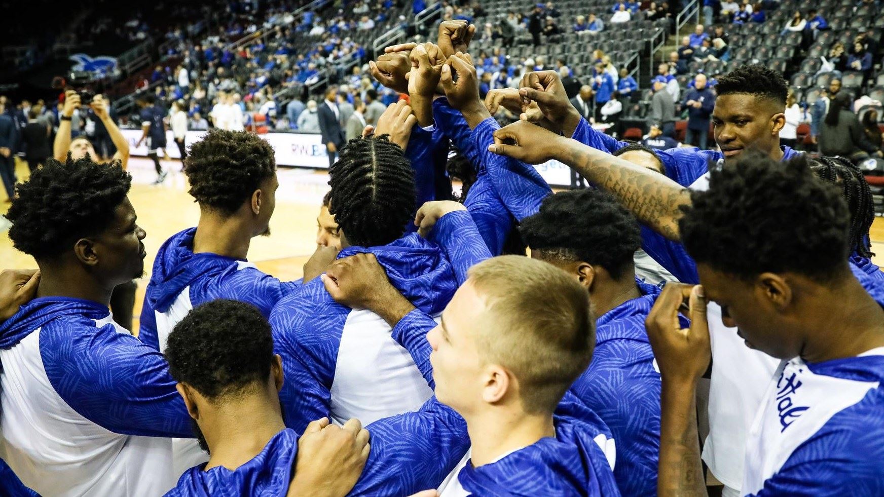 The Seton Hall men's basketball team huddles before a home game.