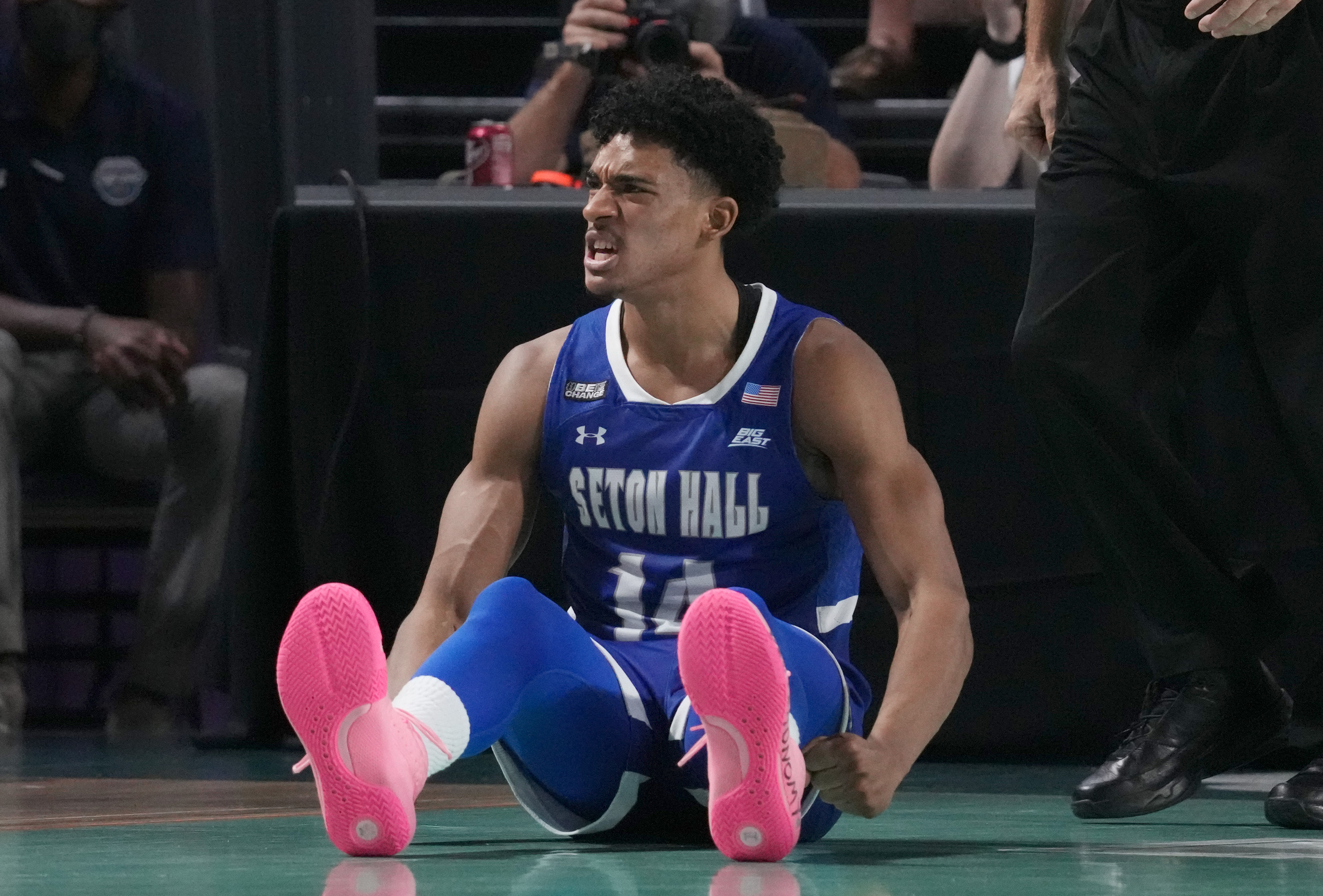 Seton Hall's Jared Rhoden celebrates on the floor after hitting a basket during a Fort Myers Tip-Off game.