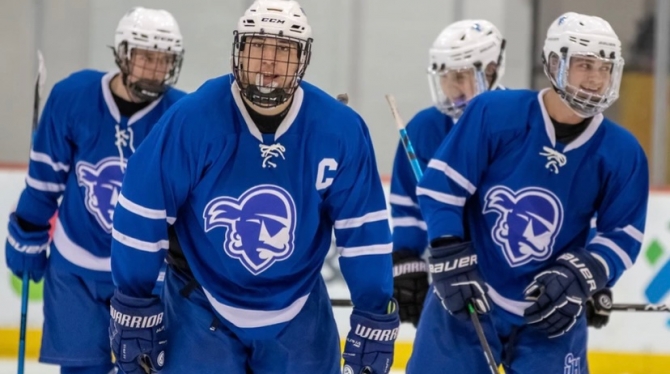 The Seton Hall men's hockey team skates on the ice during a game.