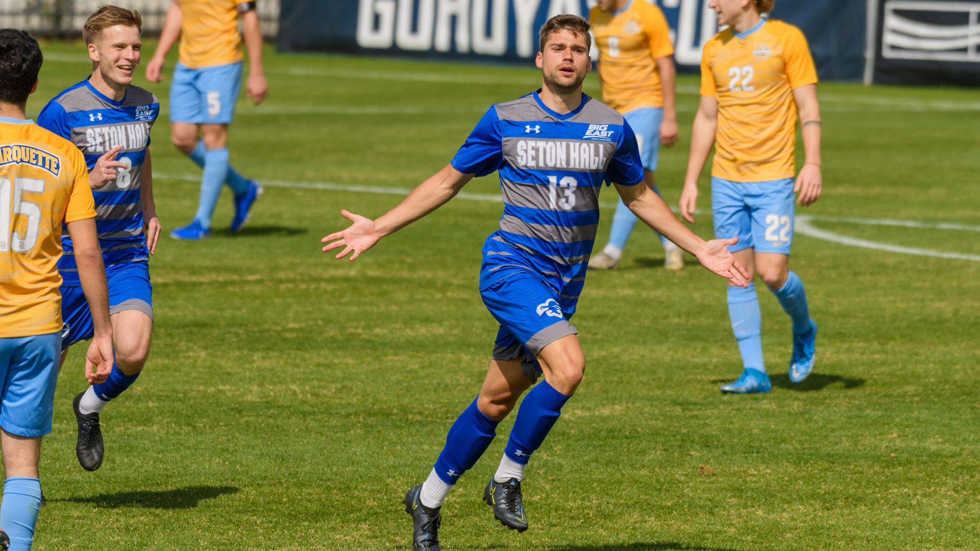 A Seton Hall men's soccer player celebrates on the field during a Big East conference match.