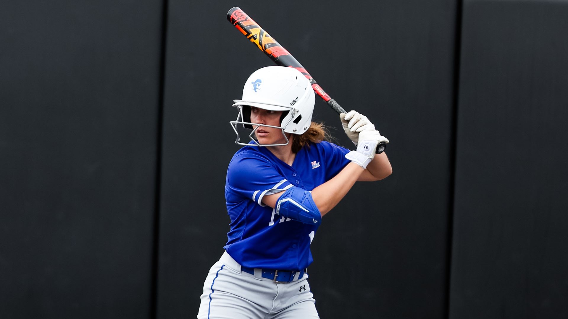 A Seton Hall softball stands in the batter's box during a home game.