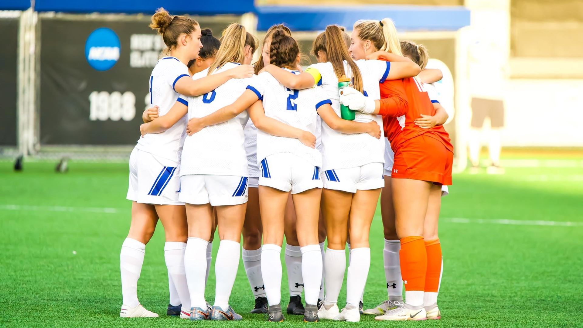 The Seton Hall women's soccer team huddles before a game at home.
