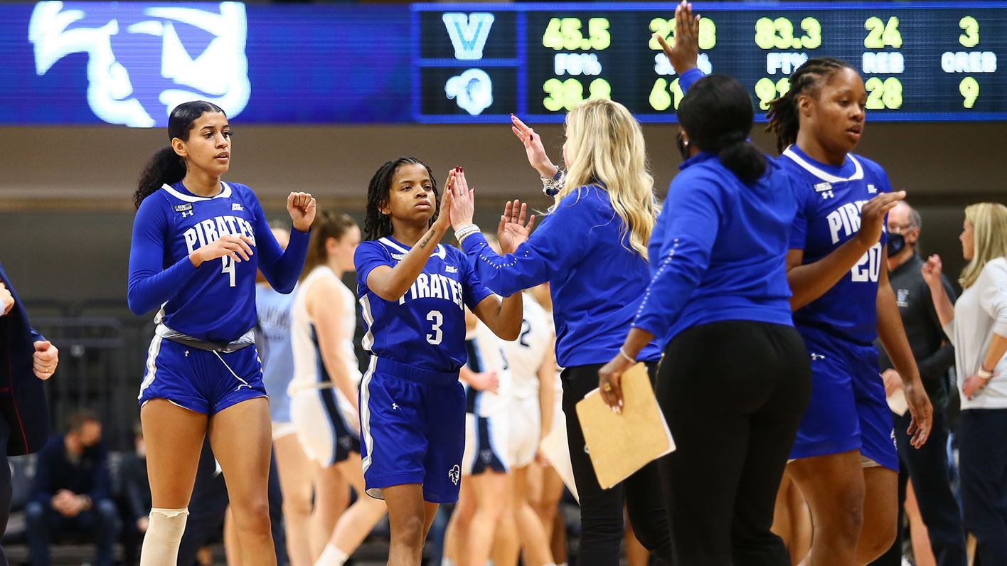 Members of the Seton Hall women's basketball team walk off the floor during a game.