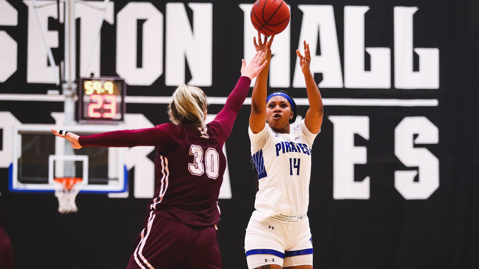 Sidney Cooks shoots the basketball over a Fordham defender during a home game.