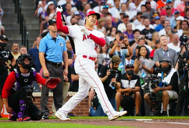 Shohei Ohtani attempts to hit a baseball in the batter's box during a Los Angeles Angels game.