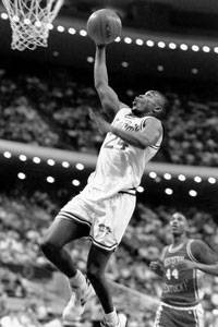 Former Seton Hall men's basketball player Terry Dehere looks to score a layup during a collegiate game.