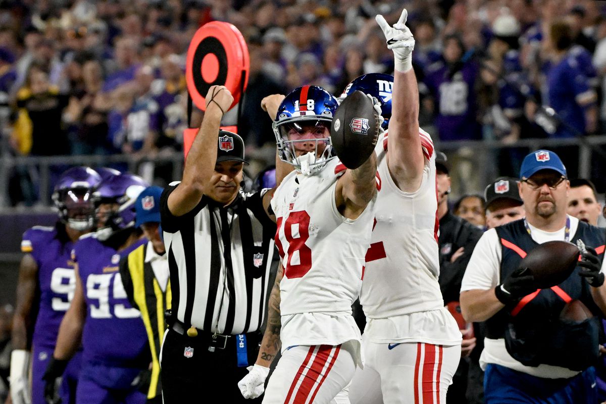 The Giants celebrate a first down against the Vikings.