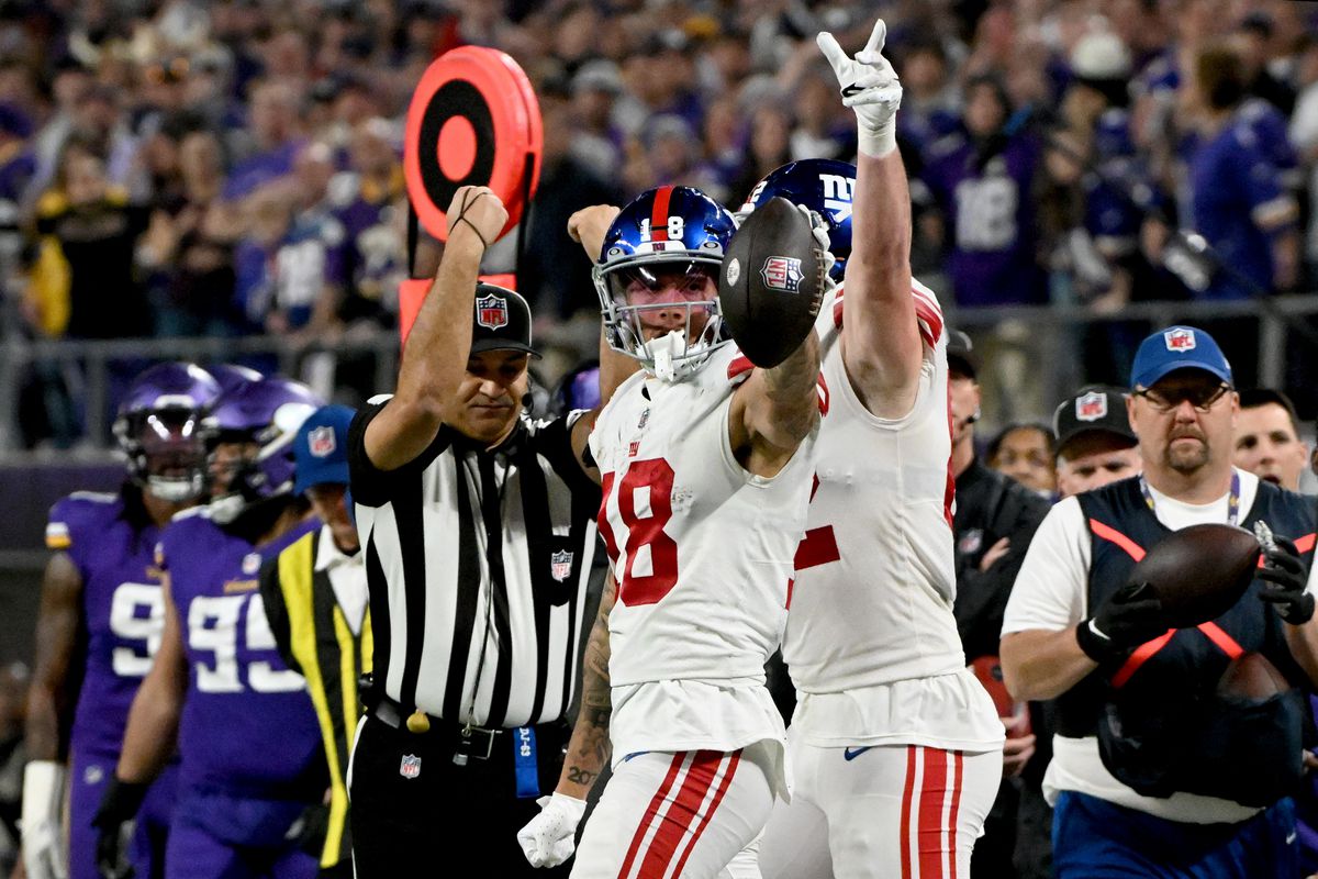 The Giants celebrate a first down against the Vikings.