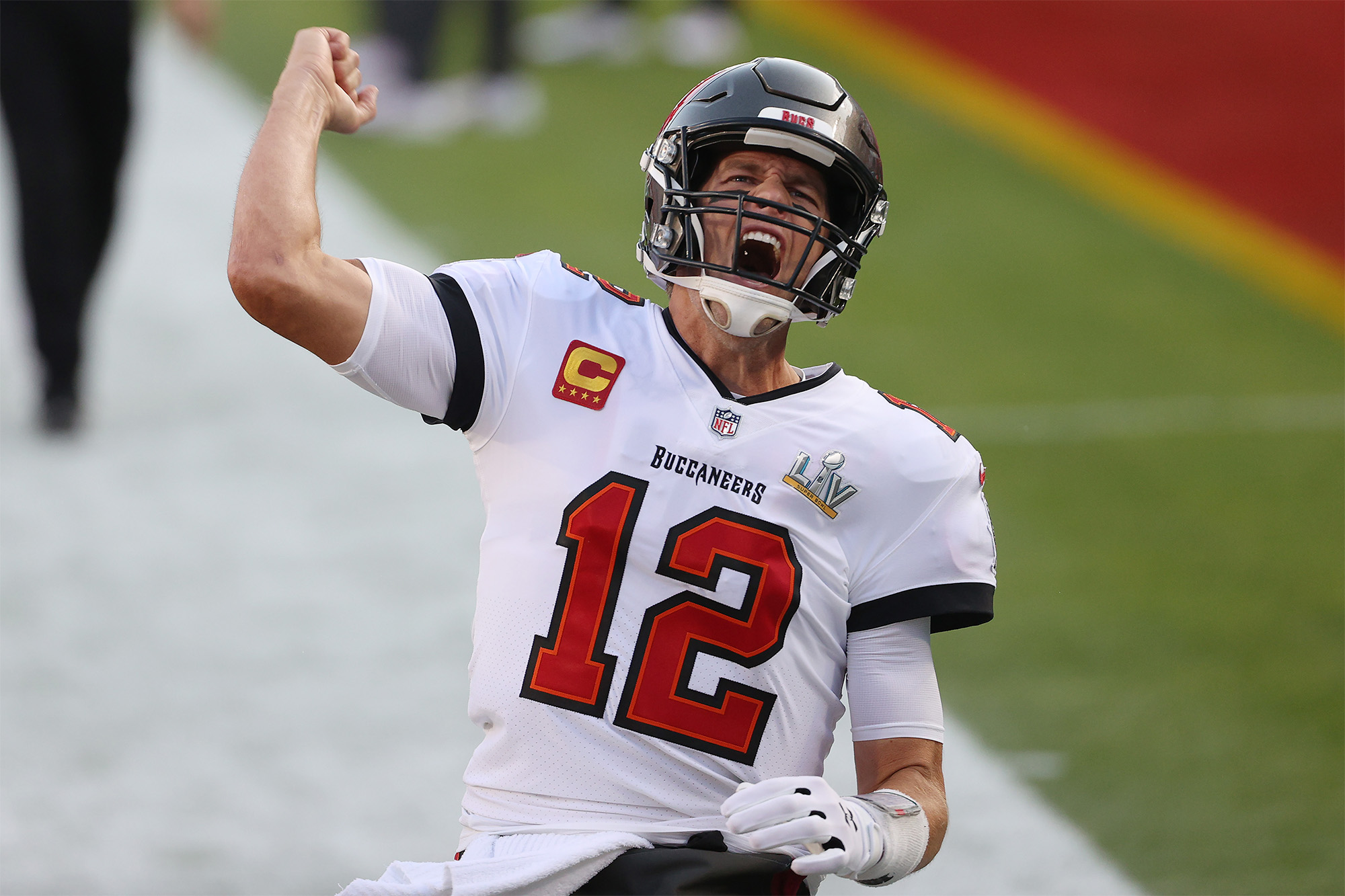 Tom Brady celebrates on the field during a Tampa Bay NFL game.