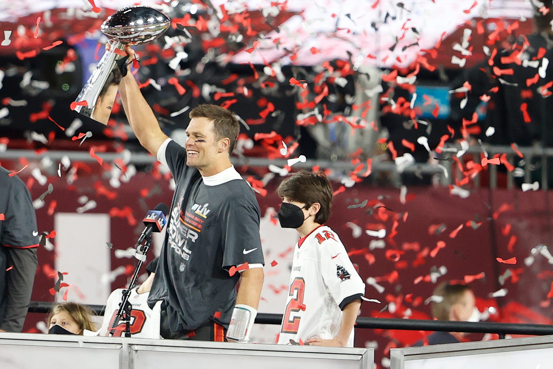 Tom Brady holds the Super Bowl trophy during the Tampa Bay Bucs' celebration.