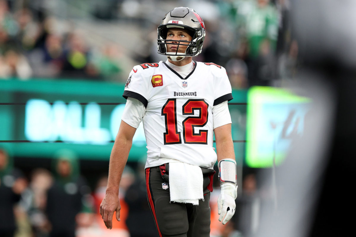 Tampa Bay's Tom Brady stands on the field during an NFL game.