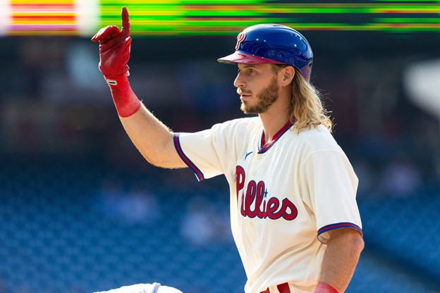 Philadelphia Phillies' Travis Jankowski stands near the batter's box and points during a game.