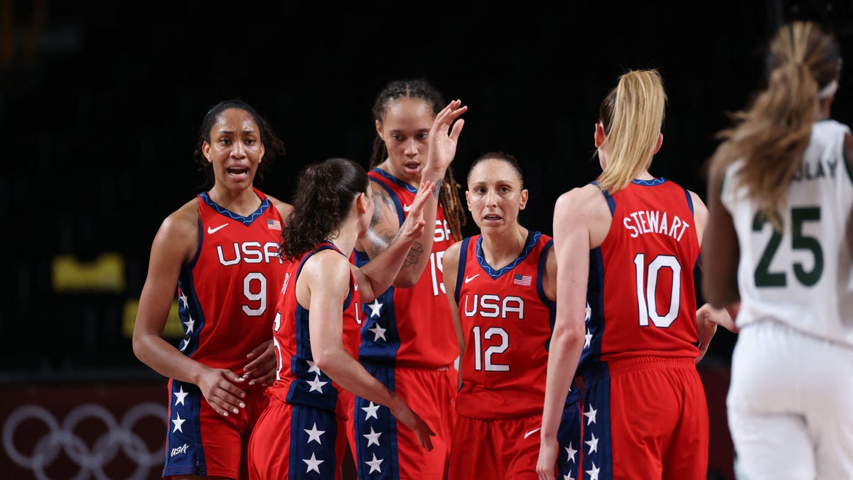 Team USA women's basketball celebrates after their opening round victory win against Nigeria.