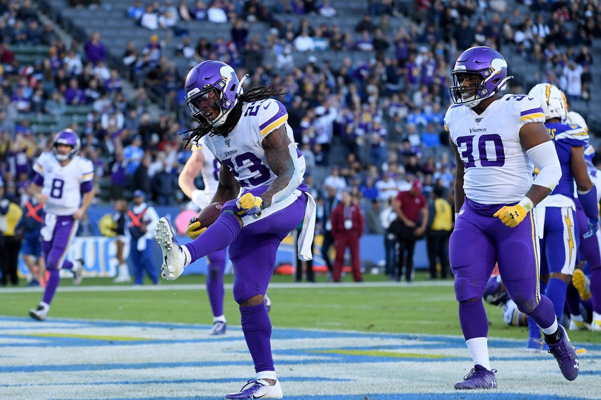 The Minnesota Vikings celebrate after scoring a touchdown during an NFL game.