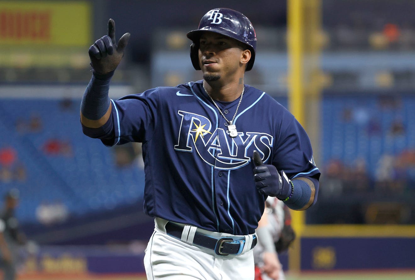 Wander Franco stands on the field with his batting helmet on during a Tampa Bay Rays game.