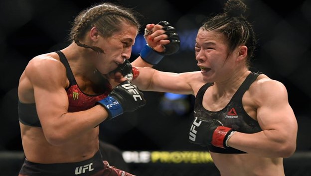 Zhang and Jędrzejczyk battle it out in the octagon.