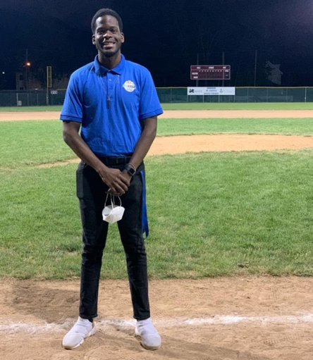 Sports Director Wilnir Louis poses on Teerner Field in Union, N.J.